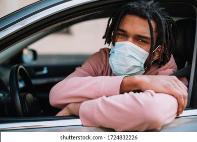 Afroamerican driver wearing medical mask  - Powered by Shutterstock