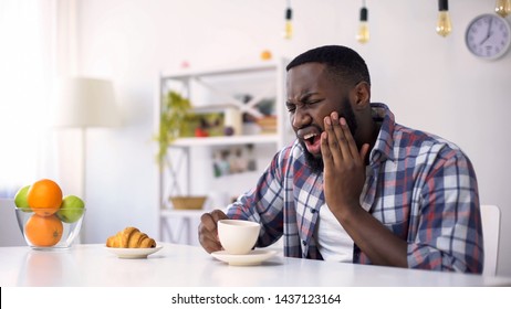 Afro-American Man Having Dental Ache, Reaction On Hot Coffee, Sensitive Teeth