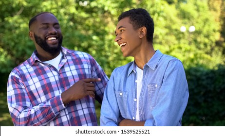 Afro-american Young And Adult Brothers Laughing Having Fun Together, Family