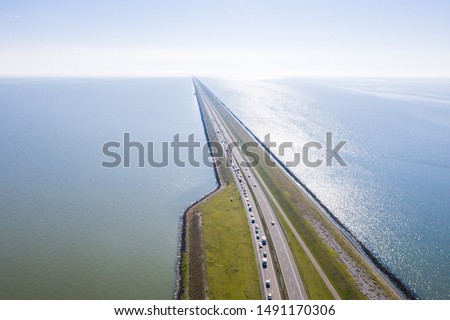 Afsluitdijk, a major dam and causeway in the Netherlands, runs from Den Oever in North Holland to village of Zurich in Friesland province, damming off the Zuiderzee, salt water inlet of the North Sea.