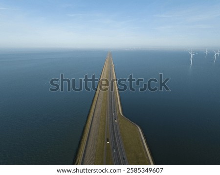 Afsluitdijk, road in endless water, between Friesland and North Holland. Dutch icon.
