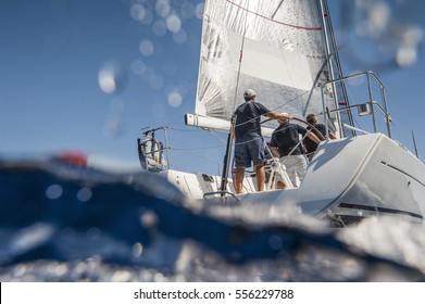 Aft of sailing boat with skipper from underwater view