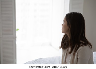 After Bad Sleep. Sad Tired Young Woman Sitting On Edge Of Bed Looking At Window In Low Spirit Having Sleepless Night Insomnia Depression, Lost In Heavy Thoughts Of Problem Divorce Abortion, Copy Space