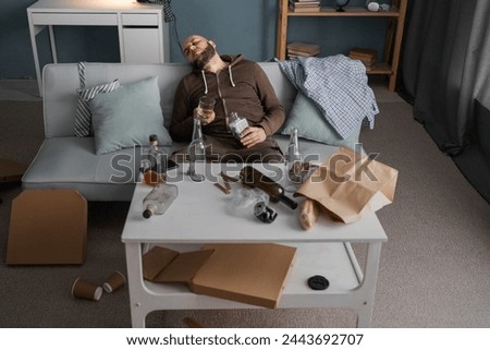 Similar – Image, Stock Photo Drunk bearded man with bottle of champagne during Christmas holiday