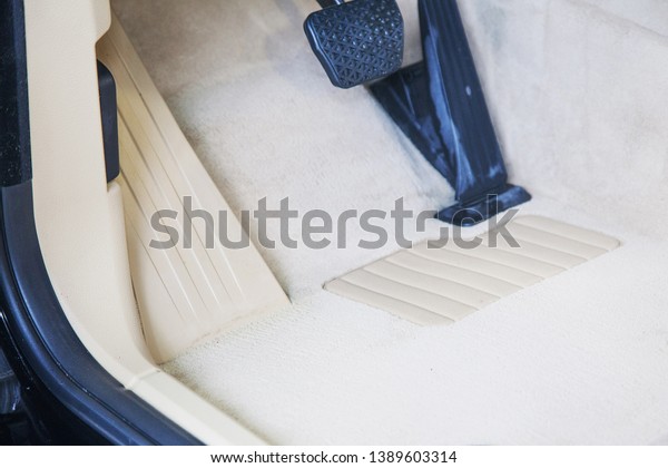 after dry cleaning car interior. Grey and white\
machine floor