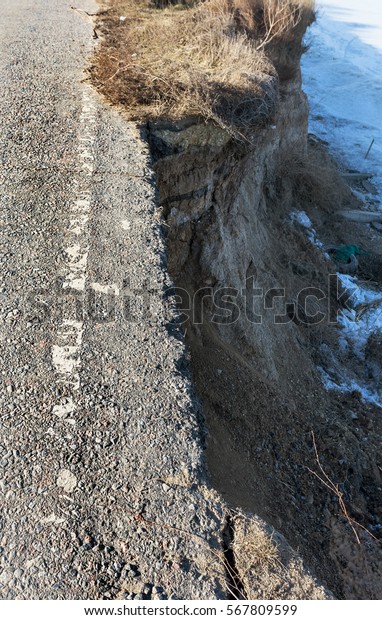 After
earthquake, and violent storm in winter and large destructive
frosts of asphalt road in landslide swept away into sea. Closed
road. Destroyed asphalt, bad road along
sea