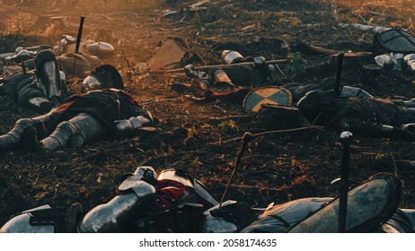 After Epic Battle Bodies of Dead and Murdered Medieval Knights Lying on Battlefield. Warrior Soldiers Fallen in Conflict, War, Conquest. Cinematic Dramatic Historical Reenactment.