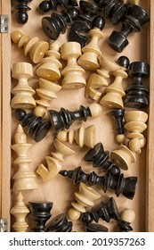After The Game, The Chess Pieces Are Placed On The Inside Of The Chessboard. Photo Taken From Above Above The Chessboard.