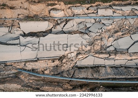After the great earthquake, some roads became completely unusable. It collapsed due to fragmentation and cracks in the connecting roads. Ruined parts of asphalt. Disaster results, earthquake. [[stock_photo]] © 