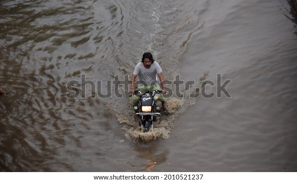 After monsoon rains in millennium city\
Gurugram, waterlogging occurred in expressway service lane near\
narsinghpur. Gurugram, Haryana, India. July 19,\
2021.