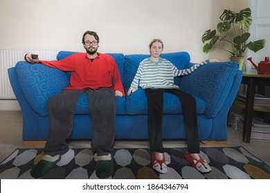 After Too Much Time Inside Binge Watching Television During Quarantine This Couple Have Become Part Of Their Sofa.