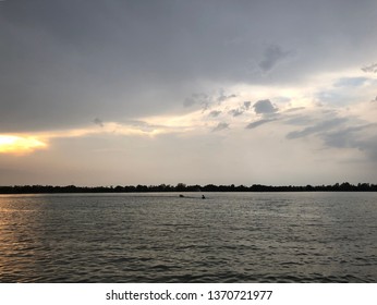 After Raining In Lake.Soft Sunshine After Storm In The Rural River.Dark Clouds And Sky.