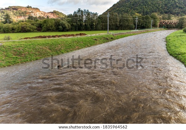 After the storm  and a lot of rain, the\
water level in Czech republic is very high. There is a risk of\
flooding. River Loucka near the town of\
Predklasteri.