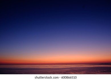 Afterglow Of The Sea And Sky, Delicate Color Gradation Of Sky, Distant Ship's Silhouette