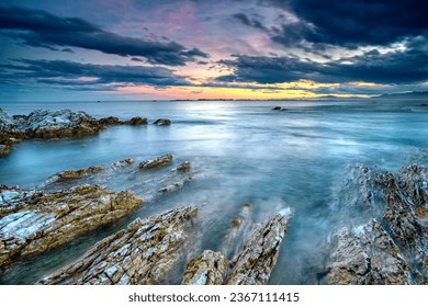 Afterglow of setting sun and incoming tide over coastal rocks near Kaikoura, South Island, New Zealand - Shutterstock ID 2367111415