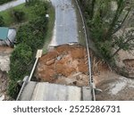 The aftermath of Hurricane Helene in North Carolina shows widespread damage, with flooding, debris, and destruction left in its wake as recovery efforts begin across the affected areas.