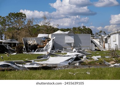 Aftermath of natural disaster in southern Florida. Badly damaged mobile homes after hurricane swept through residential area