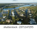 Aftermath of natural disaster. Surrounded by hurricane rainfall flood waters homes in Florida residential area