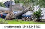 Aftermath from storm damage. High winds cause damage around Houston TX. Numerous trees have fallen over and damaged homes and vehicles. Thousands are still without power. Houston TX USA May 19, 2024