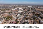Afternoon aerial view of the downtown skyline and surrounding housing of Peoria, Arizona, USA.