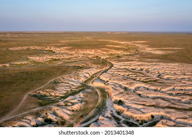 afternoon light over arroyo and badlands in Pawnee National Grassland in northern Colorado, summer scenery aerial view of Main Draw area - Shutterstock ID 2013401348