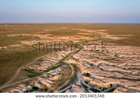 afternoon light over arroyo and badlands in Pawnee National Grassland in northern Colorado, summer scenery aerial view of Main Draw area