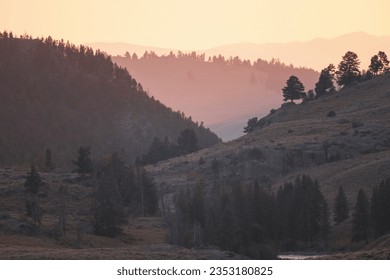 Afternoon Light Wafts Between Slopes of Hills in Yellowstone National Park - Shutterstock ID 2353180825