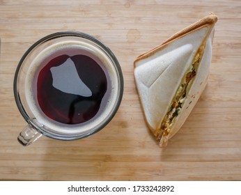 Afternoon Snack Time: Black Coffee Paired With An Egg And Tuna Sandwich