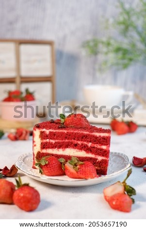 Afternoon tea timw with dessert a red velvet cake with strawberry fruits.