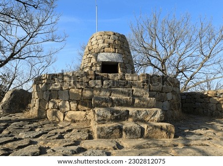 Afternoon view of stone stairs and beacon tower on Bunsanseong Fortress of Bunseongsan Mountain near Gimhae-si, South Korea
