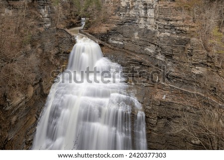 Afternoon winter photo of Lucifer Falls waterfall in Robert H. Treman State Park near Ithaca NY, Tompkins County New York.  (01-13-2024)	