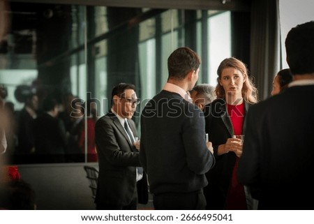 After-work rooftop networking event, where professionals connect, share ideas, and enjoy cocktails with skyline views.