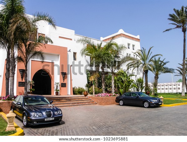 Agadir, Morocco - April 2009: chic\
auto limousines in front of the main entrance of the\
hotel