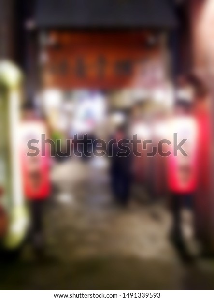 Against the\
background of the colorful Japanese Osaka OSAKA-INFO\
, it blurs\
the night view of the alley. The artistic conception of a quiet\
alley.                        \
