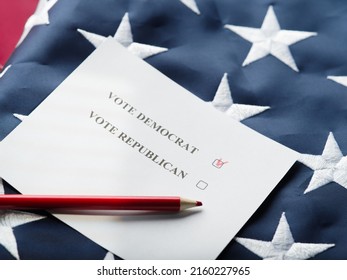 Against the background of the state American flag is a ballot paper and a pencil. An inscription calling to vote for a Democrat and a Republican. Mark opposite Democrat. Banner, poster.