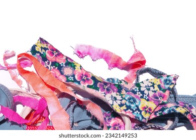 Against a pristine white backdrop, an enchanting array of fabric scraps beckons quilting and rug-making enthusiasts. Endless creativity for crafty homemakers. - Shutterstock ID 2342149253