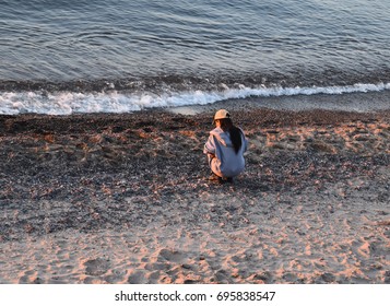 Agate Hunting On The Shore Of Lake Superior At Sunset