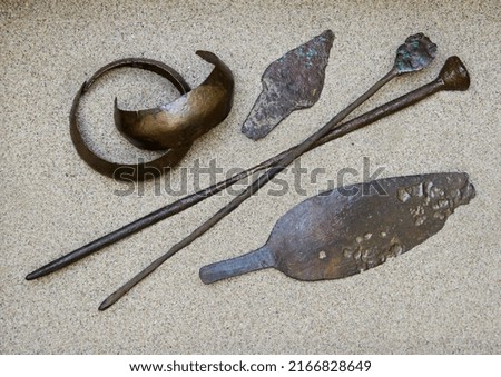 Age of Bronze. Andronovo culture. Middle of the 2nd millennium BC. Bronze knives, bracelets and wands.