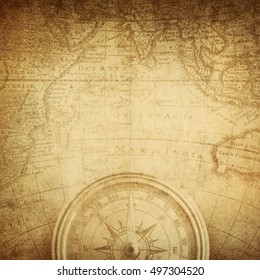 Aged Antique Nautical Compass And Old Map. Pirate And Nautical Theme Grunge Background.