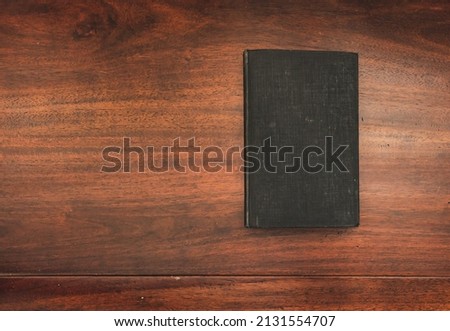 aged black hardcover book with copy space