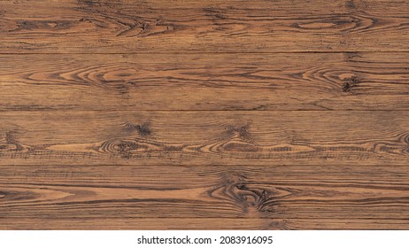 Aged Brushed Wood Background With Copy Space. Wood Surface Of The Table With A Warm Golden Hue. Close-up Of The Background Knocked Down From Rough Boards.