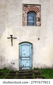 Aged Building Facade Featuring Rustic Architecture and Timeworn Architectural Details