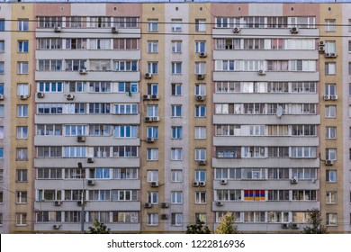  Aged dirty facade residential building,  multi-storey house, soviet architecture. Front view close up.