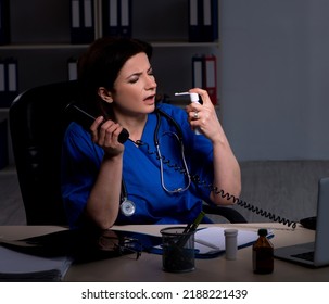 Aged Female Doctor Working At Night Shift