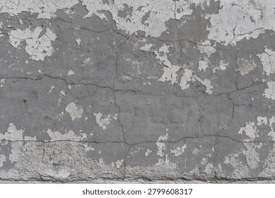 Aged gray cement wall with weathered plaster remnants