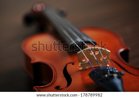 aged handmade violin on dark background
