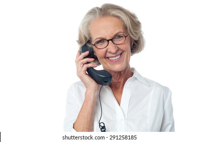 Aged Happy Woman Answering A Phone Call