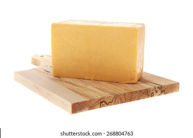 aged italian deli fresh cheddar cheese served on wooden cutting plate isolated over white background