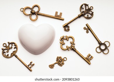 Aged keys and heart. Search for understanding, reciprocity in love and relationships, concept - Shutterstock ID 2093801263