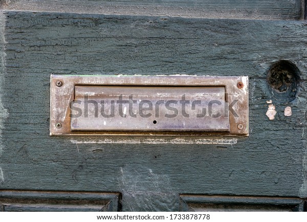 Aged Mail Slot on Old\
Painted Door